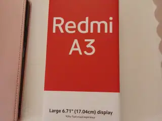 Ny Redmi A3 mobiltelefon med cover til salg.