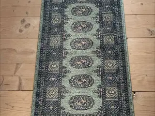 Lille tæppe i grønne nuancer