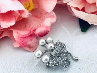 Broche i fin stand 