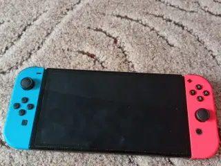 Nintendo Switch OLED + 2 spil + mocriSDXC