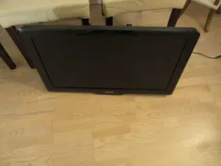 Philips fladskærm tv med fjernbetjening vægbeslag.