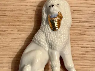 Antik puddelfigur af porcelæn