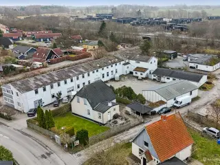Projekt - udviklingsejendom til opførelse af 15 boligenheder og 1 erhvervsenhed